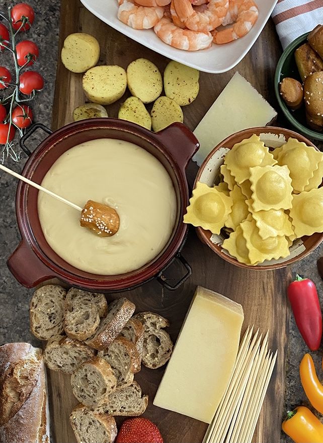 the food is ready to be eaten and served on the wooden platter, along with other foods