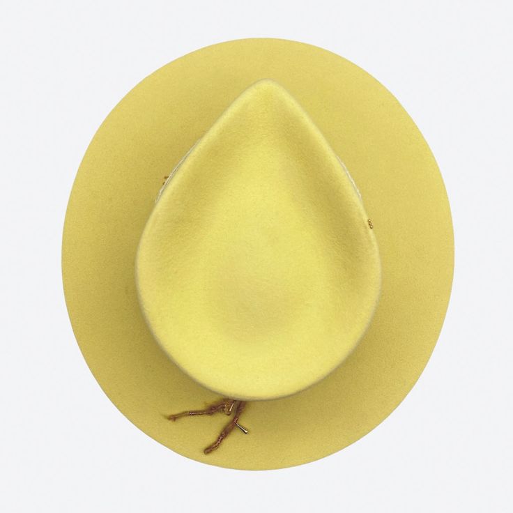 A lemon felt fedora that will brighten up the room! With simple lines, this hat is full of small gold details. Silk and linen is the perfect companion for summer. Off-white linen and vintage silk ribbons 18k gold filled chain link chain 14k gold plated drop charm 14k gold plated faceted bead 24k gold plated crimp beads Silk thread with 18k gold square wire ring & 24k gold rondelle beads 18k gold over sterling silver triangle charm Quartz crystal points 100% silk interior lining 100% fur felt Swe Luxury Adjustable Gold Fedora, Adjustable Gold Wide Brim Fedora, Handmade Gold Wide Brim Hat, Adjustable Brimmed Gold Fedora, Elegant Gold Fedora Felt Hat, Felt Fedora, Crimp Beads, Fedora Hat, Silk Thread