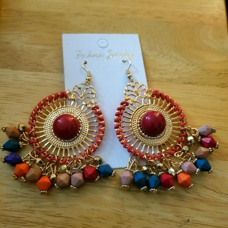 Questions? Leave A Comment Below! Red Vibrant Summer Jewelry, Red Metal Earrings For Summer, Bohemian Red Hoop Earrings With Colorful Beads, Red Chandelier Earrings With Colorful Beads, Red Bohemian Hoop Earrings For Summer, Colorful Bohemian Hoop Earrings For Party, Orange Bohemian Earrings For Festive Occasions, Bohemian Red Hoop Earrings With Dangling Beads, Red Bohemian Earrings With Dangling Beads