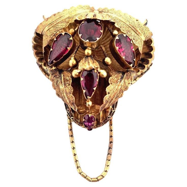 Antique 14k Yellow Gold Georgian Leaves Brooch with Garnet  Elevate your style with this breathtaking antique Georgian brooch crafted in 14k yellow gold. The brooch features a stunning design of intricately detailed leaves. Adorning the piece are five pear cut garnet gemstones, adding a rich and vibrant touch. With a total weight of 7.8 grams, this brooch exudes both beauty and history. Selling Price $2,200.00 Appraisal Price $3,300.00 "Embrace the allure of these earrings and let them ignite yo Antique Yellow Gold Brooches With Intricate Design, Traditional Yellow Gold Collectible Brooch, Ceremonial Gold Brooches With 17 Jewels, Traditional Yellow Gold Brooches For Formal Occasions, Traditional Yellow Gold Formal Brooches, Ceremonial Yellow Gold Brooch With Intricate Design, Ornate Yellow Gold Brooch For Ceremonial Use, Antique Baroque Brooches With 17 Jewels, Ornate Yellow Gold Brooches For Ceremonial Use