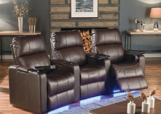 two recliners sitting next to each other in front of a fireplace