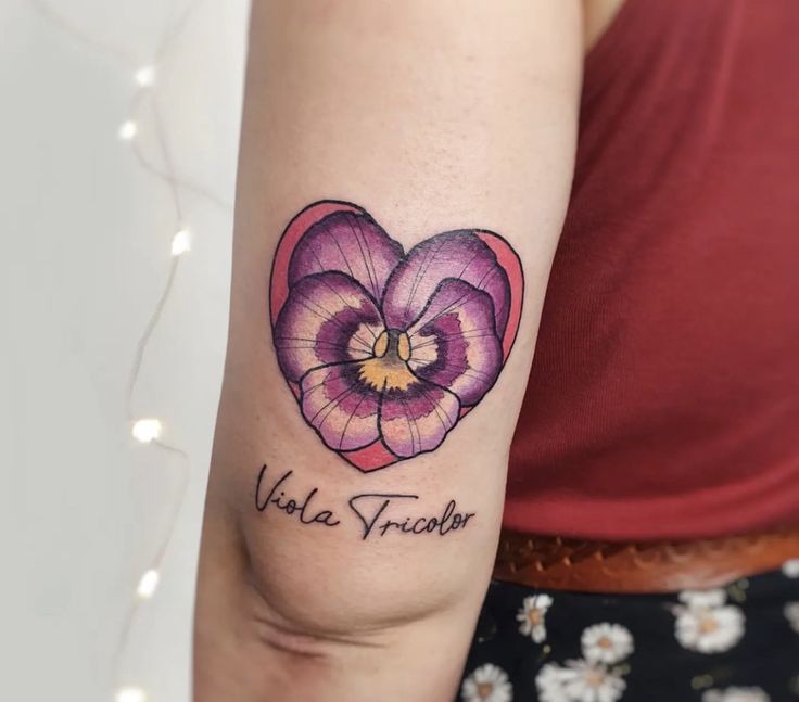 a woman's arm with a tattoo on it that says, violet frecker