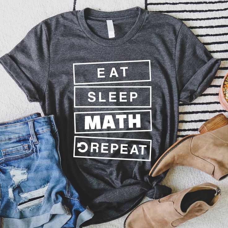 a t - shirt that says eat sleep math repeat next to some jeans and shoes