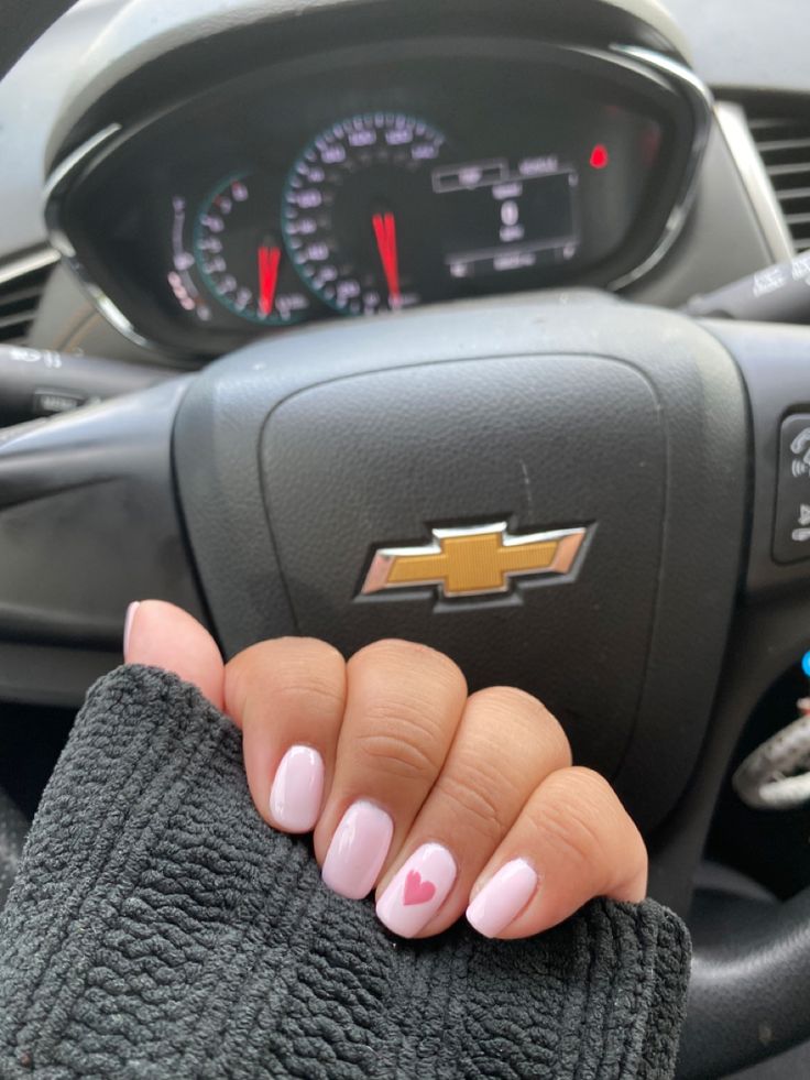 The heart took me like 10 minutes but i did it! 💗 Pale Pink Nails With Heart, Short Nails Ideas Heart, Pink Heart On Nails, Round Heart Nails, White And Pink Heart Nails, Light Pink With Heart Nails, Light Pink Nails With Accent Nail, Short Nail Designs With Hearts, Light Pink Nails Heart