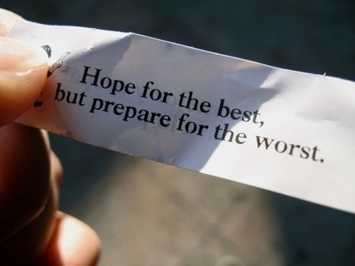 someone holding up a piece of paper that says hope for the best, but prepare for the worst