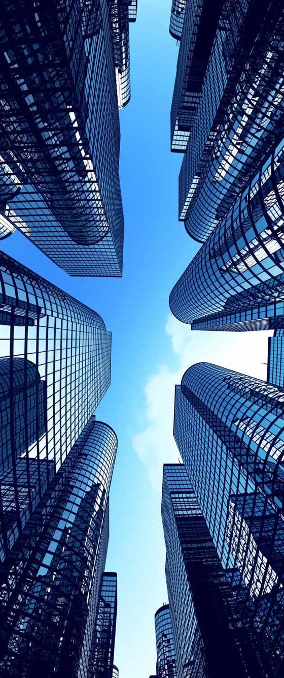 looking up at skyscrapers from the ground