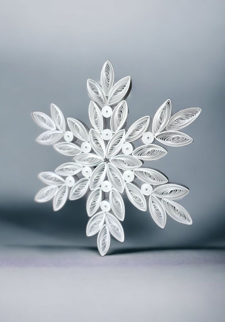 a white snowflake on a gray background