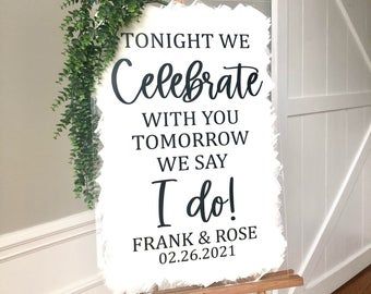 a sign that says tonight we celebrate with you tomorrow we say i do