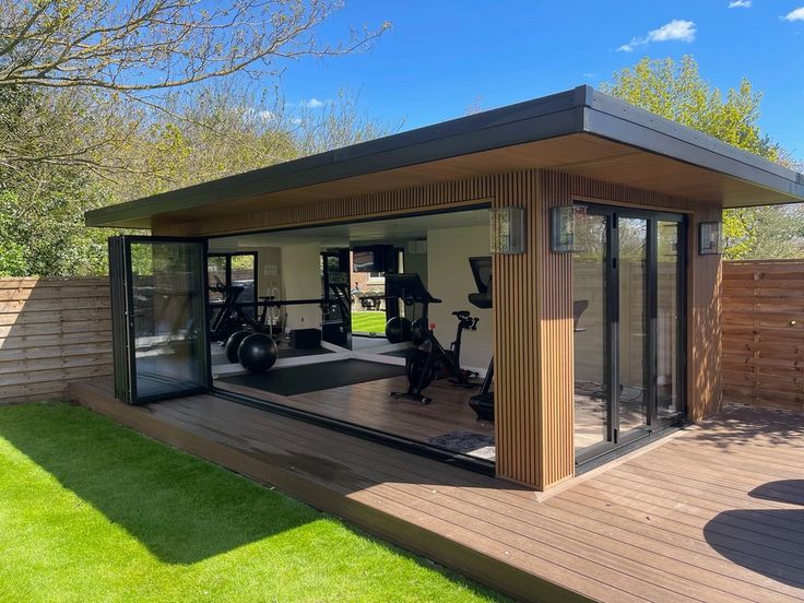 a home gym with exercise equipment in the backyard