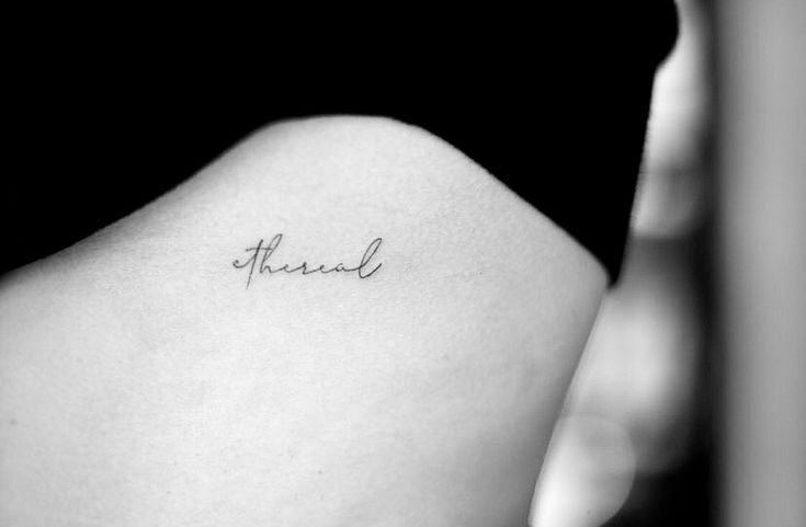 the back of a woman's left shoulder with an inscription that reads, friend