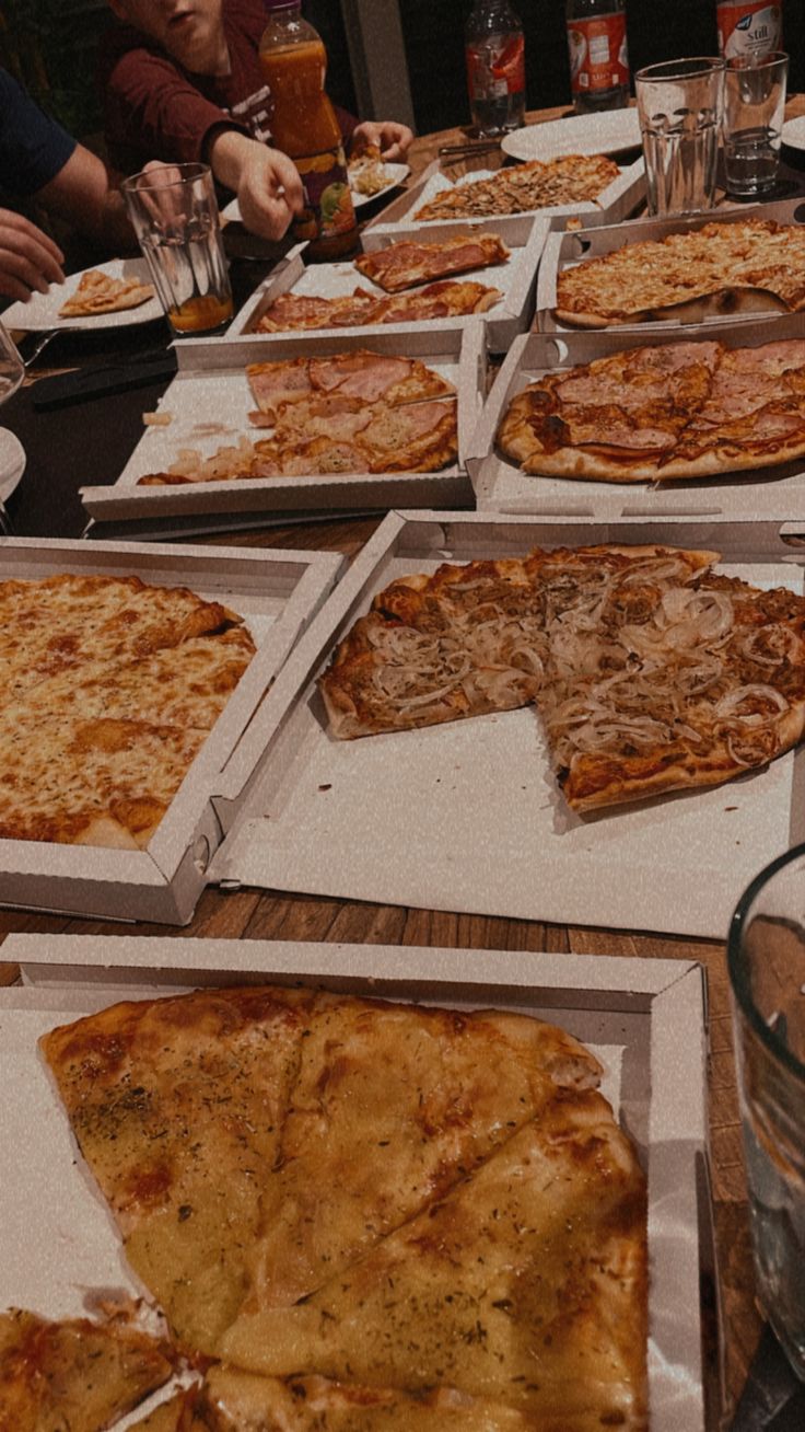 many pizzas are on the table ready to be eaten