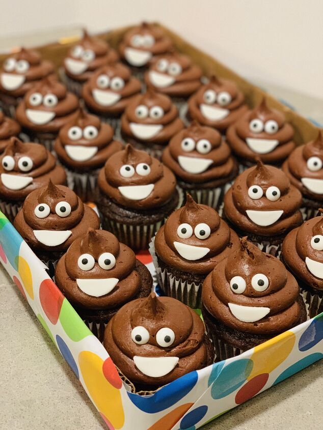 chocolate cupcakes with googly eyes in a box