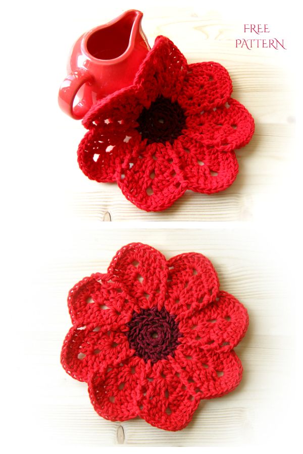 two crocheted flower coasters on a wooden table with a red coffee cup