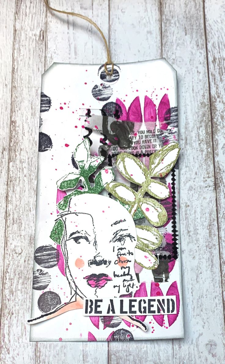 a tag with an image of a woman's face and flowers on the front