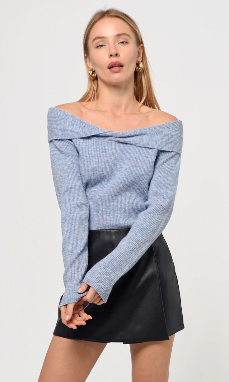 An off-the-shoulder knit that folds at the top. The garment is made of a recycled blend and hugs around the shoulder. The stretchy fabric is light but thick enough to hold in some heat.  Off-the-shoulder top Ribbed Twist front detail Stretchy Self: 74% RECYCLED POLY, 15% Nylon, 6% Wool, 5% Spandex Length: 20" Chest: 14 Off Shoulder Knit Top, Luxury Women Fashion, Twist Front, Stretchy Fabric, Hand Warmers, Modern Woman, Lay Flat, Knit Top, Cold Water