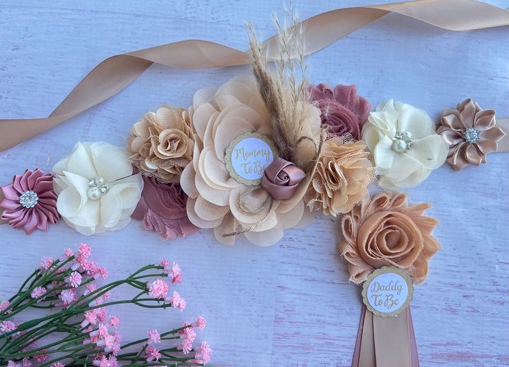 some flowers and ribbons on a table