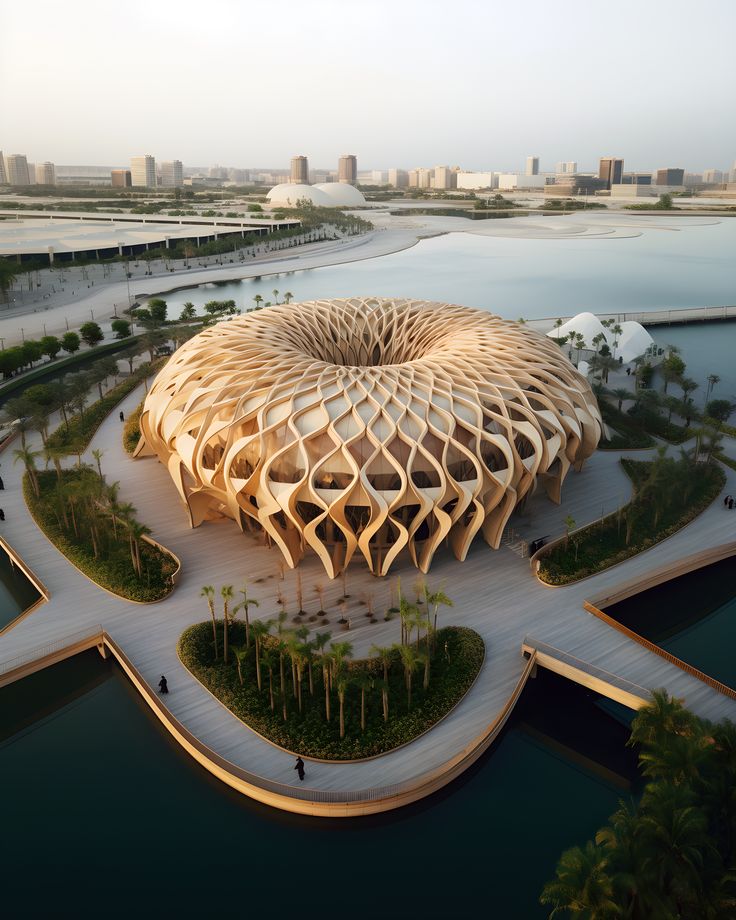 an aerial view of a building in the middle of a body of water with palm trees around it