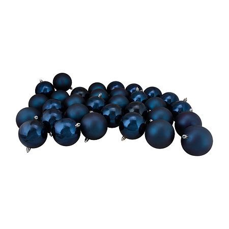 a pile of blue christmas balls on a white background