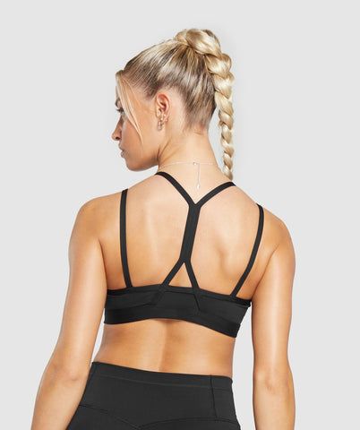 IT’S NOT YOU, IT’S YOUR SPORTS BRA With lightweight, breathable designs, comfortable cups and supportive straps, you can rely on our sports bras to be there for you, and for yours. • Cute double strap feature• Removable padding lets you to wear it how you want• Light V-neck• Stay-put elasticated underband SIZE & FIT• Medium support• Body fit• Model 1 is 5’8” and wears a size XS• Model 2 is 5’8” and wears a size XS MATERIALS & CARE• 78% Polyester , 22% Elastane SKU: B8A6A-BB2J Black Sports Bra, Sports Bras, Body Fit, Fitness Models, Sports Bra, Models, V Neck, My Style, Bra