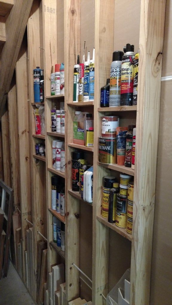 the shelves are filled with many different types of paint