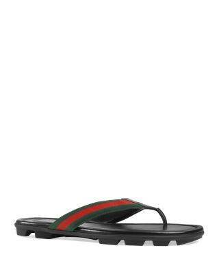 A signature Gucci web strap imbues these sun-ready sandals with an instantly recognizable flair. Sandals Gucci, Pool Slide, Red Web, Tom Ford Men, Buy Gucci, Hugo Boss Man, Calvin Klein Men, Green And Red, Beach Sandals