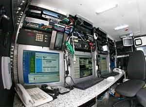 the inside of an airplane with computers and monitors