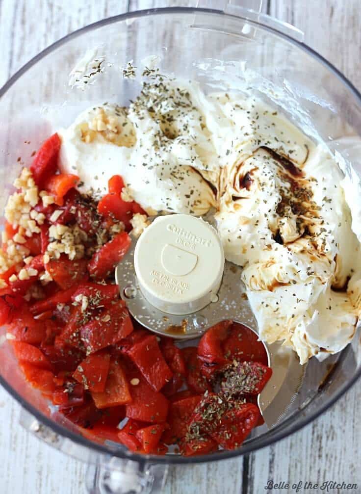 ingredients in a food processor ready to be blended into meatballs and other foodstuffs