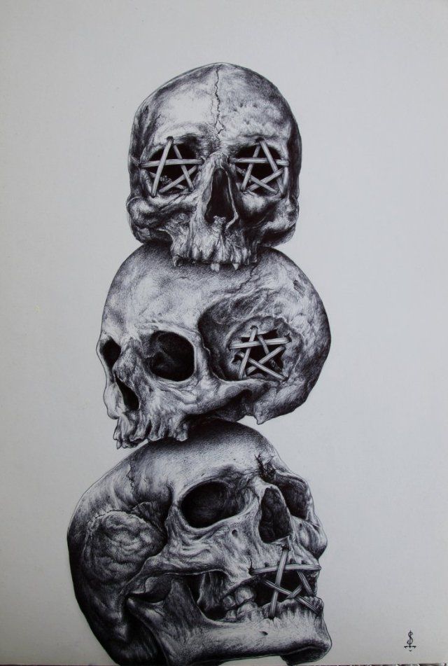 three skulls stacked on top of each other with pen and ink drawings in the middle