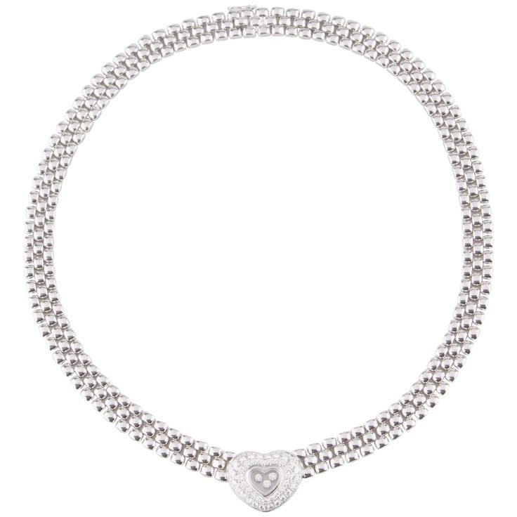 Gorgeous Chopard Happy Diamond series choker done in solid 18K White Gold Triple row necklace design showcasing a diamond incrusted Heart Pendant 45 total Diamonds Bezel-set surrounding the heart-shaped Pendant 3 loose "floating" Diamonds in the center behind sapphire glass Chopard serial #81/2267-20 Total weight: 113.5 grams Includes original Chopard case & box White Gold Heart Necklace, Chopard Necklace, White Gold Cross Necklace, Diamond Cross Necklaces, Gold Cross Necklace, Heart Pendant Gold, Rose Gold Heart, Necklace Design, Gold Heart Necklace