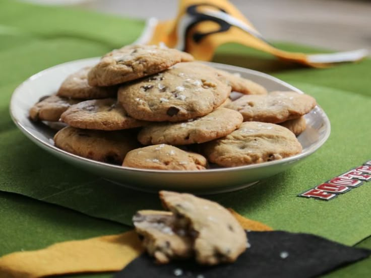 a bowl filled with cookies sitting on top of a table