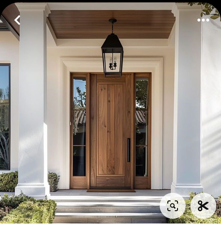 the front door of a house with a lantern on it