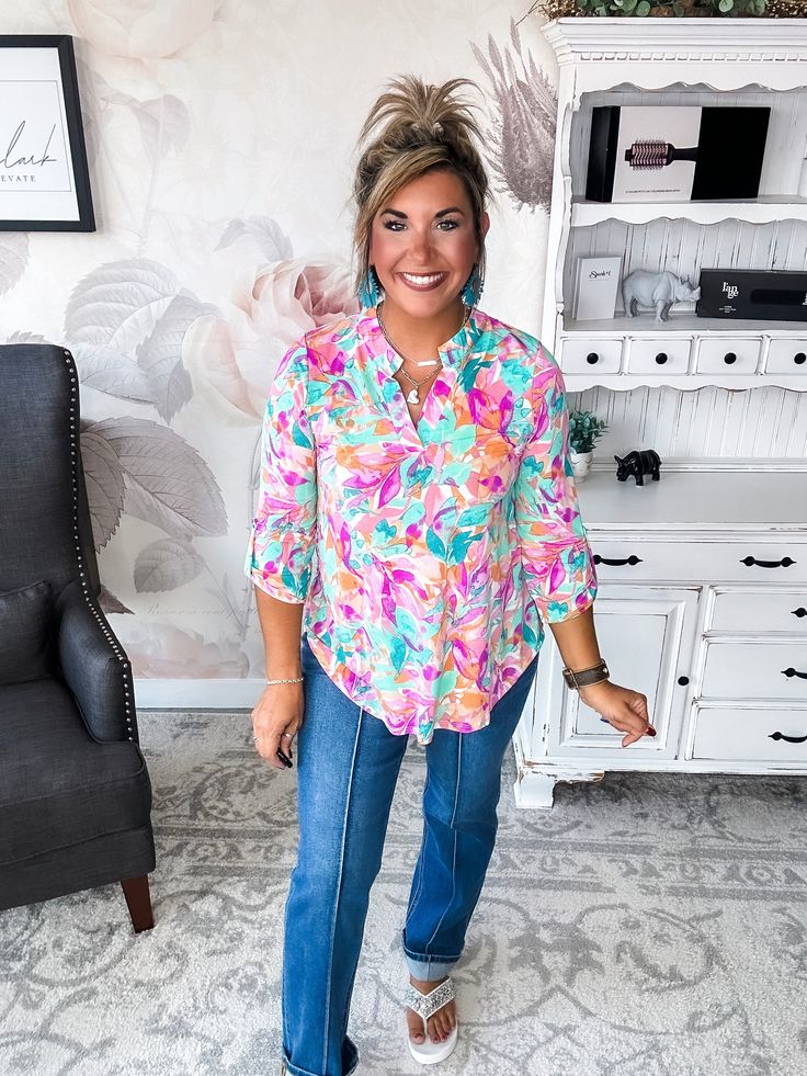 Some tops make a subtle statement. This isn’t one of them. While its notched V-neck and 3/4 sleeves keep things chic. Pair this top with your favorite distressed denim for a laid-back boho vibe or a structured blazer for a splash of color in the office. However you style it, one thing’s for sure: in this scene-stealing top, you’ll be the center of attention. After all, when you’ve got a print this unapologetic and a silhouette this flattering, the only option is to make a memorable impression. F Trendy 3/4 Sleeve Blouse For Brunch, Trendy Beach Top With 3/4 Sleeves, Trendy Tops With 3/4 Sleeves For Brunch, Trendy Beach Tops With 3/4 Sleeve, Long Sleeve Blouse With Frayed Hem For Spring, Trendy Half Sleeve Spring Blouse, Spring Split Neck Blouse For Brunch, Spring Vacation Tops With 3/4 Sleeves, Trendy Spring Tops With 3/4 Sleeves