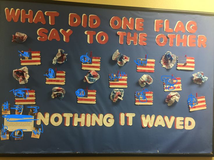 a bulletin board that has been decorated with american flags and the words, what did one flag say to the other?