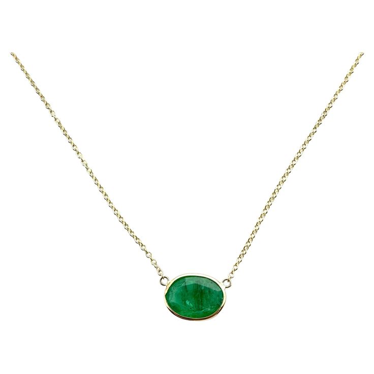 A fashion necklace crafted in 14k yellow gold with a main stone of an oval-cut emerald weighing 3.09 carats would be a stunning and luxurious choice. Emeralds are known for their captivating green color and timeless elegance, and the oval cut adds a classic touch to the necklace. Solitaire Necklace, Green Oval, Solitaire Necklaces, Necklace Craft, Green Necklace, Birth Month, Jewelry Plate, Bezel Setting, Oval Cut