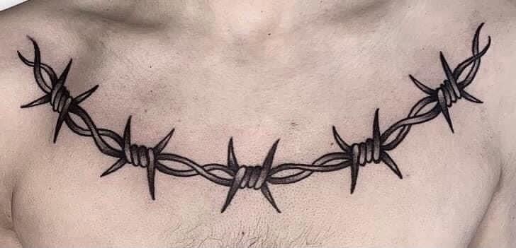 a man's chest with barbed wire on it