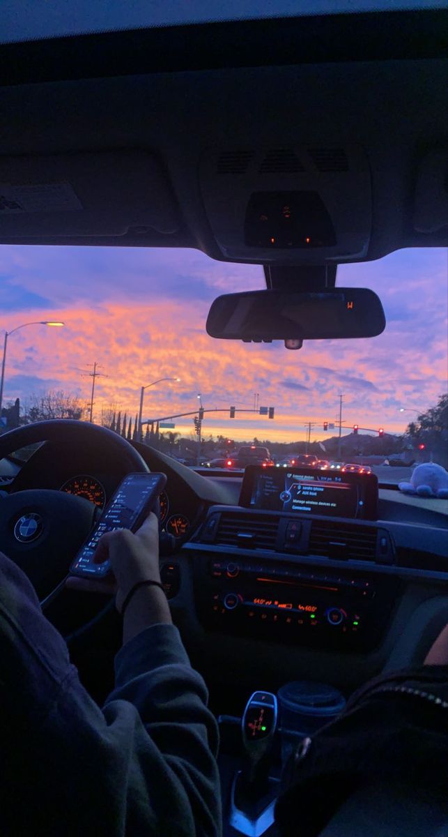 the view from inside a car at sunset