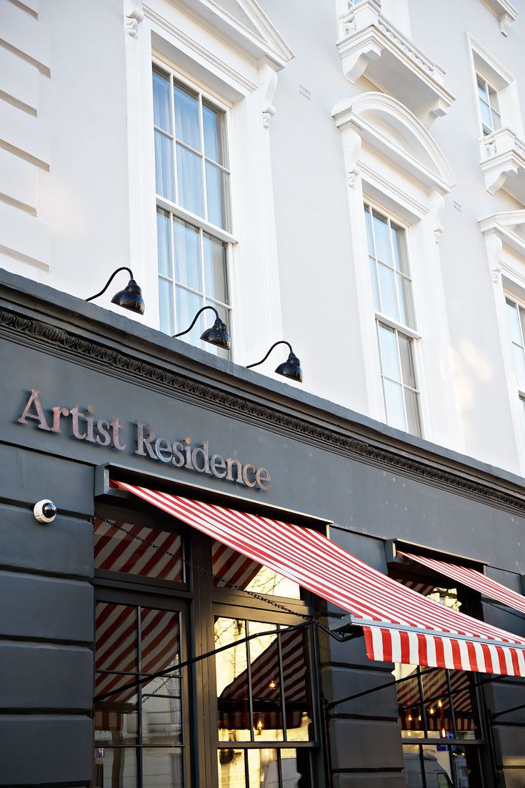 the front of a building with awnings on it