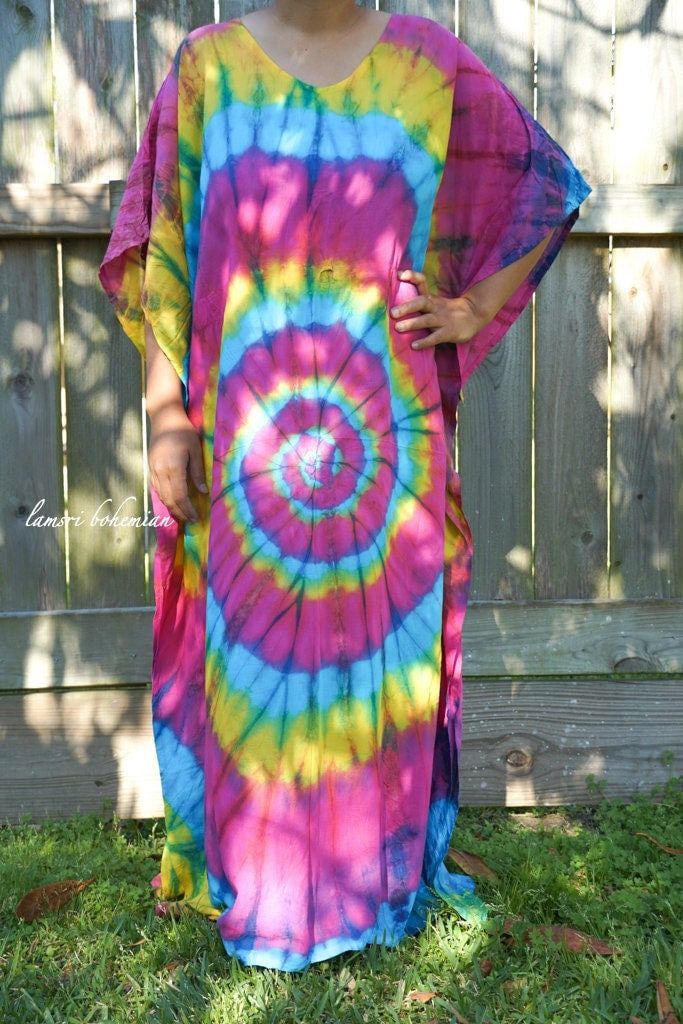 "🌈 Tie Dye Kaftan Dress, Loose Fit Tie Dye Dress, Hippie Tie Dye Kaftan, Tie Dye Clothing, Oversize Kaftan Dress, Tye Dye Caftan Dress Measurement and detail: 👉Fabric: 100% Breathable and Comfy Rayon 👉Method: Hand Dyed 👉Special Feature: Adjustable rope around the waist to tighten the kaftan 👉Size: One Size Fits Most (M-3XL) Extremely comfy 👉Boho/Hippie /Festival/Beach/Tropical/Fancy/UniqueTheme 👉Length of Dress: 55\" 👉Width of Dress: 45\" 👉Bust 60\"-80\" 👉The back is identical to front Multicolor Kaftan With Natural Dye For The Beach, Beach Tie Dye Maxi Dress With Natural Dye, Hand-dyed Tie-dye Kaftan For Beach, Tie Dye Free Size Kaftan For Beach, Tie Dye Free Size Beach Kaftan, Beach Tie-dye Free Size Kaftan, Tie Dye Kaftan For Festival Beachwear, Tie-dye Beachwear Kaftan For Festival, Casual Hand Dyed Kaftan For Beach