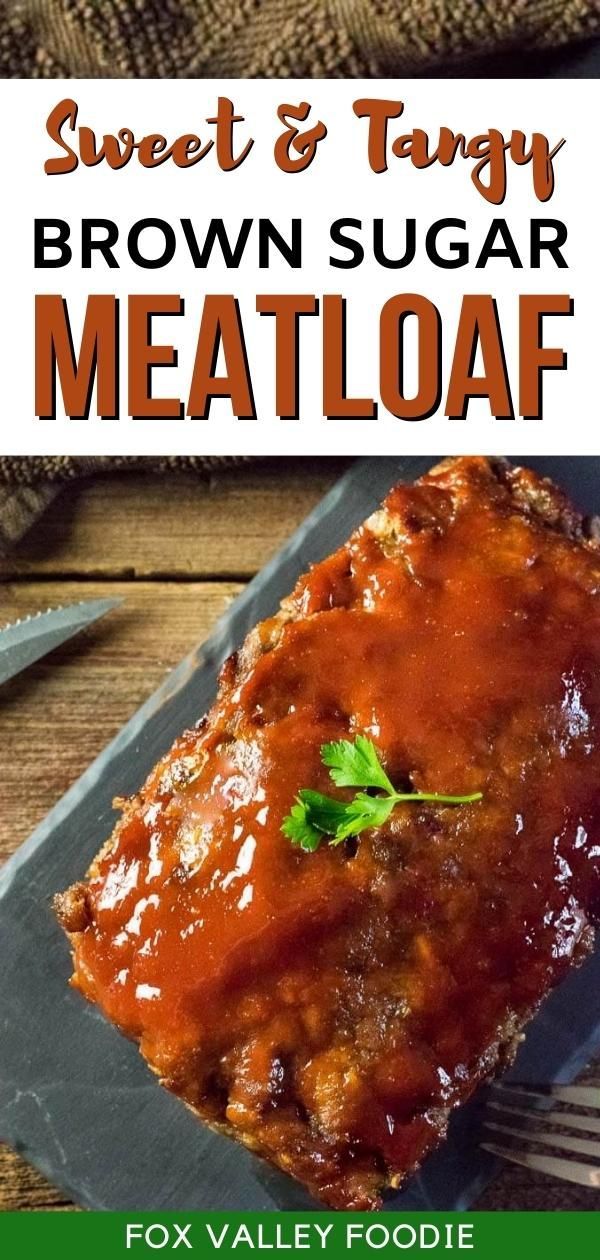 brown sugar meatloaf on a slate plate with fork and knife next to it