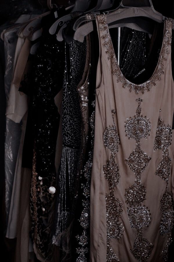 there are many dresses on display in the closet, including one with sequins