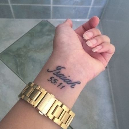 a woman's wrist with a tattoo on it that reads, fearless set 1 11