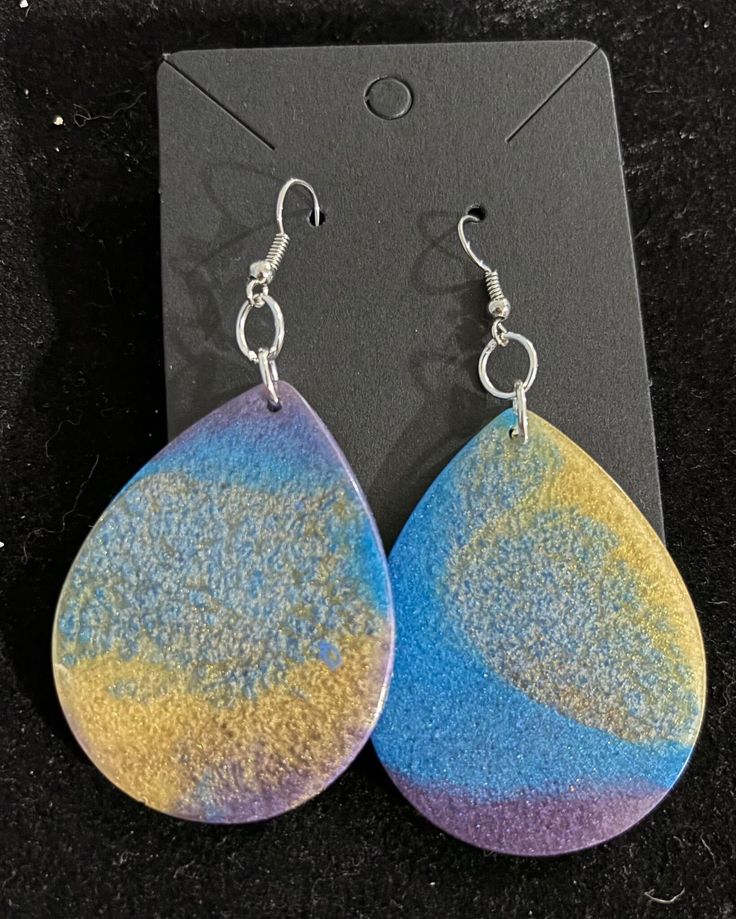 Large epoxy tear drops style earrings on stainless steel fishhooks. Custom color request available feel free to message any questions. Hand Painted Adjustable Teardrop Jewelry, Trendy Blue Teardrop Earrings For Gifting, Trendy Blue Teardrop Earrings Gift, Trendy Blue Teardrop Earrings For Gift, Trendy Hypoallergenic Dangle Teardrop Earrings, Trendy Drop Earrings As A Gift, Trendy Multicolor Teardrop Jewelry, Trendy Hypoallergenic Teardrop Earrings For Gift, Everyday Multicolor Teardrop Jewelry