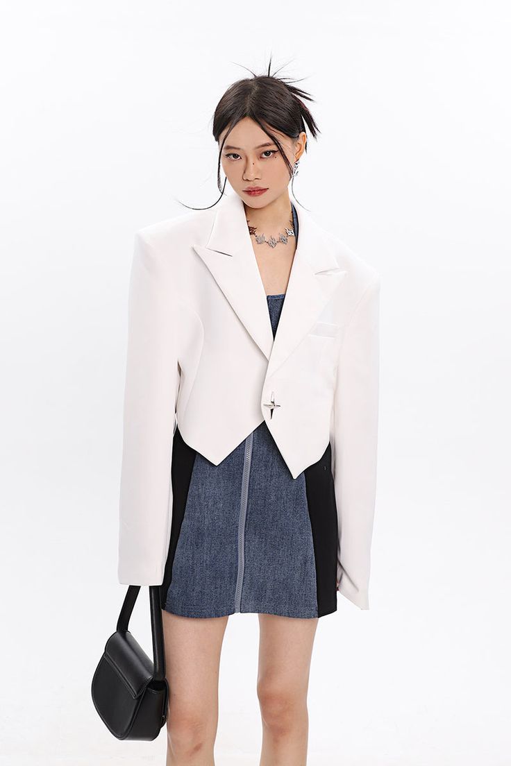 This cropped blazer is perfect for the modern woman. With a boxy fit and shoulder pads, this blazer gives you a sophisticated and polished look. The star button adds a touch of fun and minimal office wear or businesscore. Wear this blazer to work, or out for a smart casual evening.

Gender: Women
Material: Polyester (100%)
Length: Cropped Trendy Cropped Formal Blazer, Trendy Cropped Blazer For Formal Occasions, Trendy Tailored Cropped Jacket For Office, Chic Cropped Blazer For Office Wear, Formal Cropped Buttoned Jacket, Formal Cropped Jacket With Buttons, Modern Cropped Jacket For Office, Chic Formal Single-breasted Cropped Jacket, Chic Single Breasted Cropped Jacket For Formal Occasions