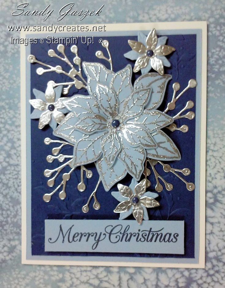 a blue and white christmas card with silver flowers