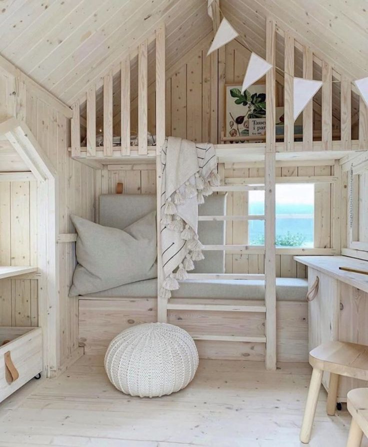 an instagram photo of a room with wooden walls and white furniture, including a loft bed