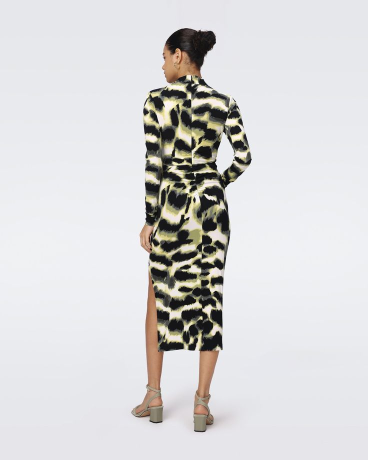 Made from matte jersey, the Sonja midi dress has a soft feel and a smooth finish. This piece has a high neck, long sleeves, and a close fit. Knotted detail gathers at the hip for an extra edge.Eloisa is 5 Foot and 8 Inches and wearing a size XS. Wrap Dress Dvf, Side Twist, Lupita Nyong, Stylist Outfit, Abstract Print Dress, Midi Wrap Dress, Long Sleeve Turtleneck, Wrap Dress Floral, Bodycon Midi