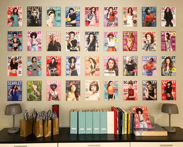 the wall has many magazines on it