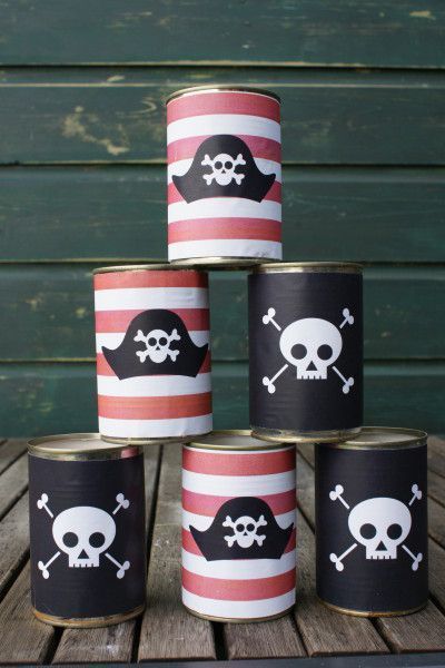 four black and red pirate canisters with skull and crossbones on them