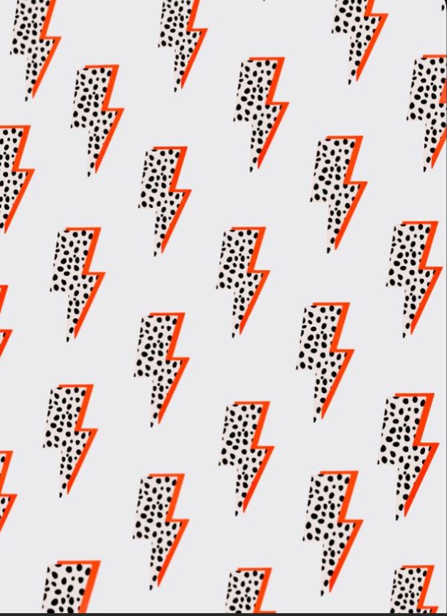 an orange and black pattern on a white background with lightning boltes in the middle