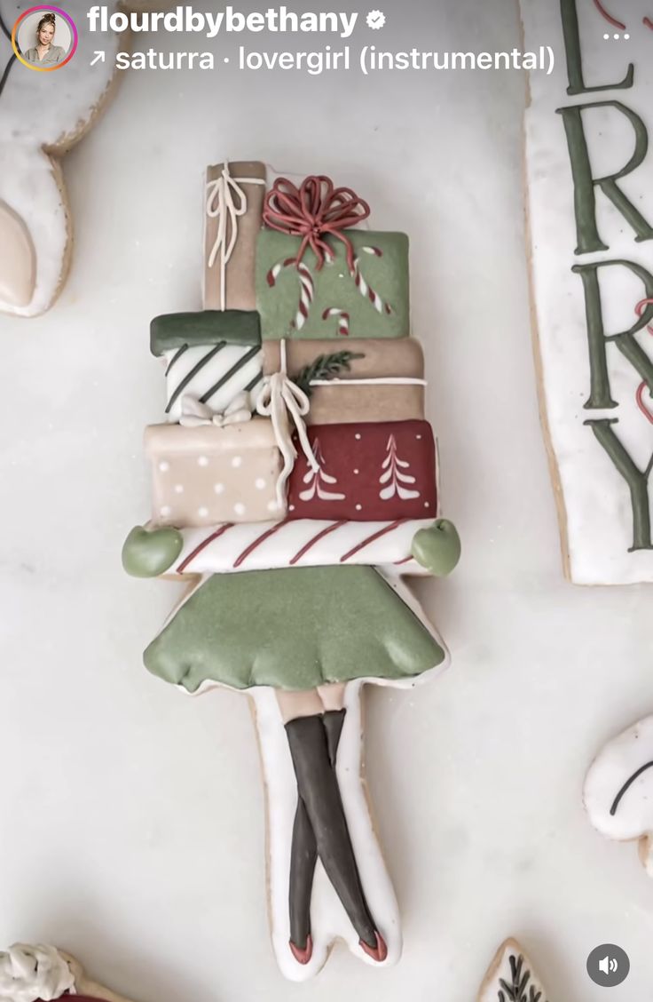 decorated cookies are stacked on top of each other in the shape of a christmas tree